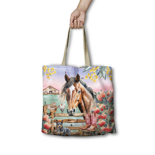Lisa Pollock Country Dusk Tote Bag (RSB109) with a horse, cattle dog, farm fence, wattle, and waratah flowers against a sunset sky.